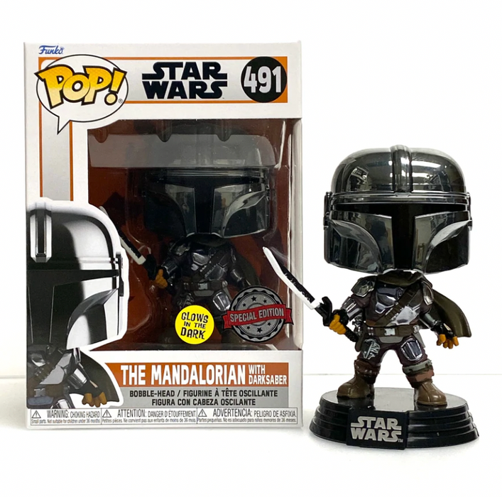 A glow-in-the-dark Funko Pop! figure of The Mandalorian holding the Darksaber.